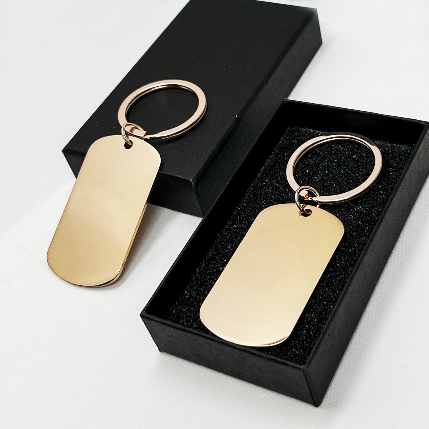 Gold oval keychain in a premium black gift box β A perfect personalised present
